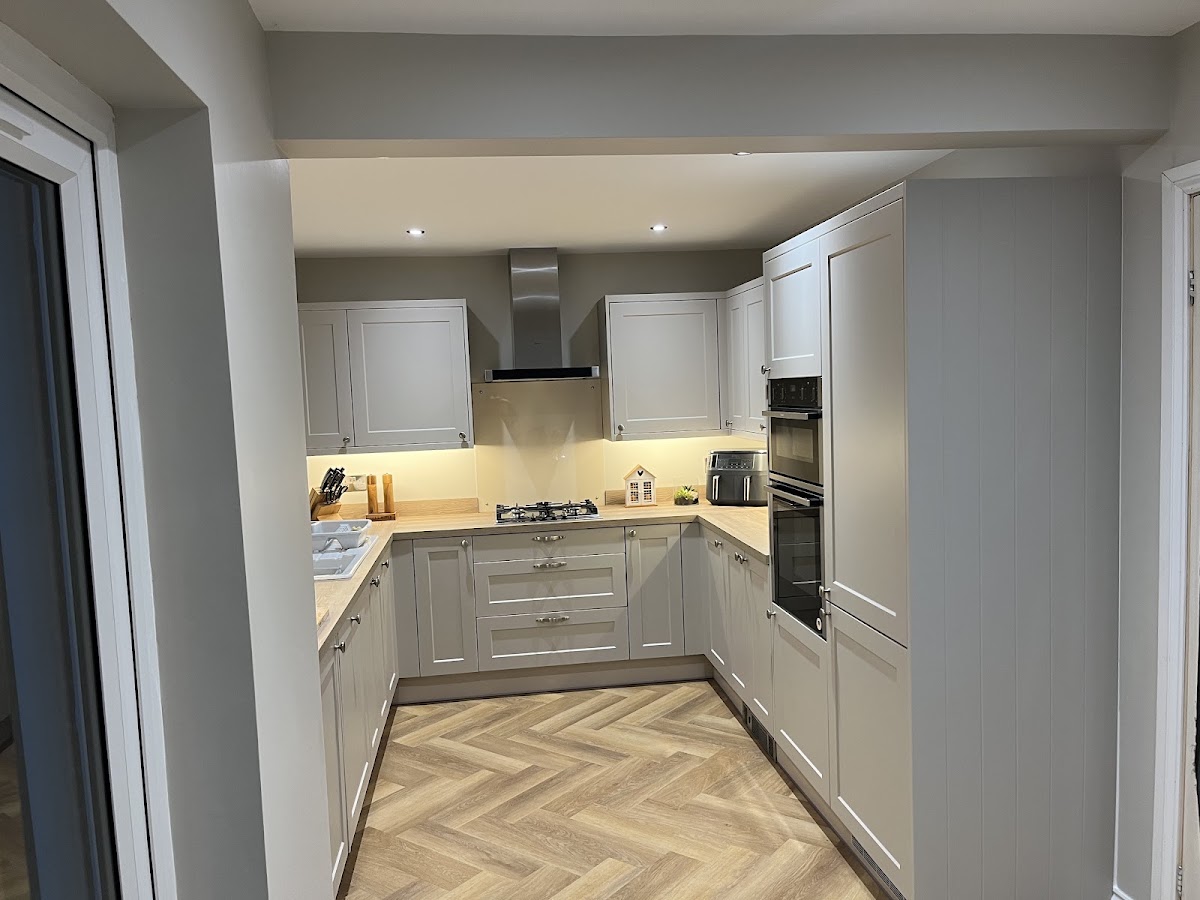 Grey shaker kitchen with herringbone flooring fitted by Glen McNaughton