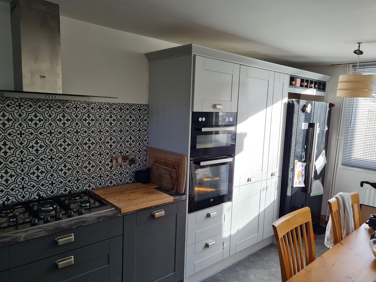 Graphite kitchen with patterned Moroccan splashback tile fitted by Glen McNaughton