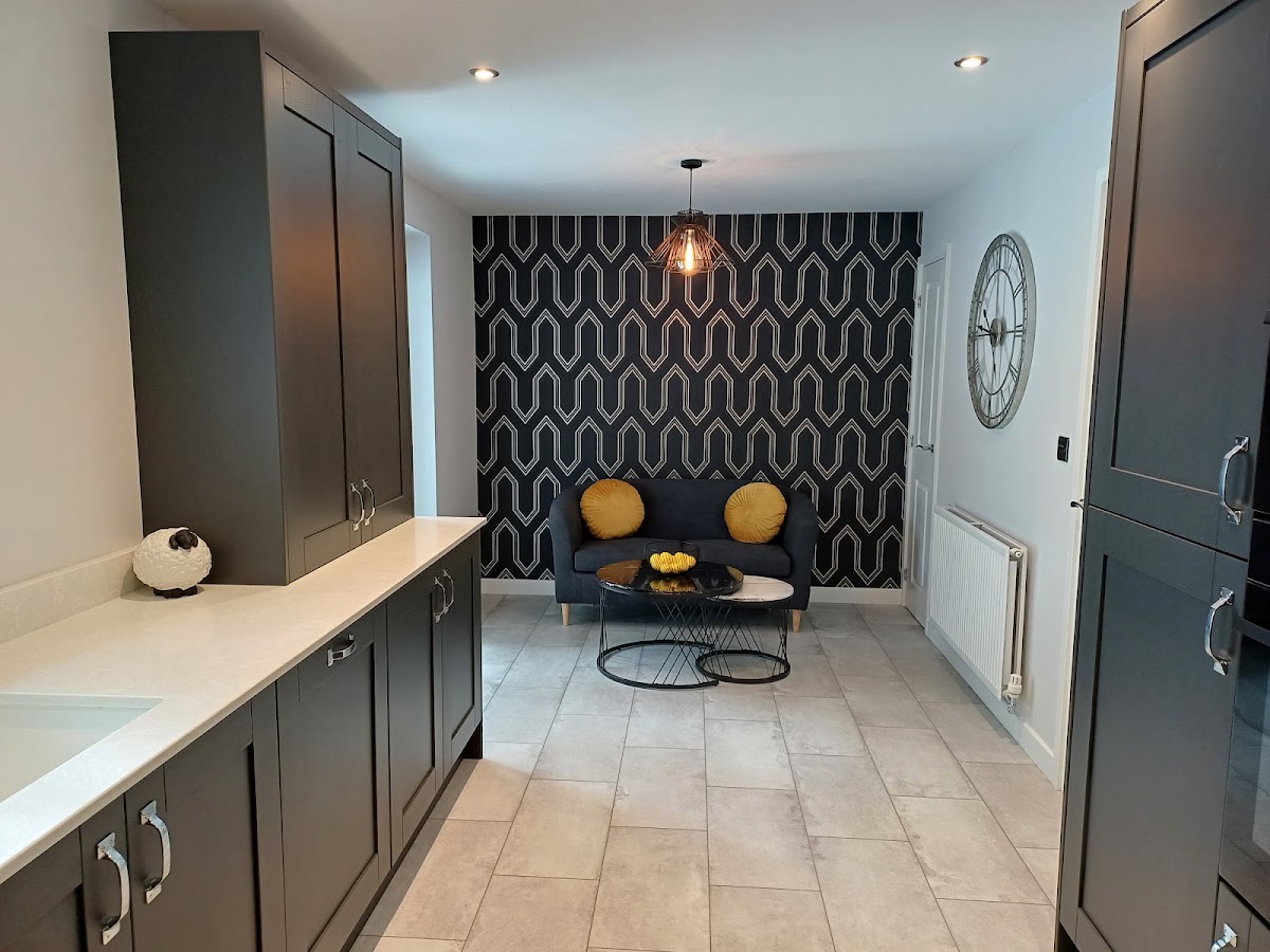 Graphite shaker kitchen with feature seating area fitted by Glen McNaughton