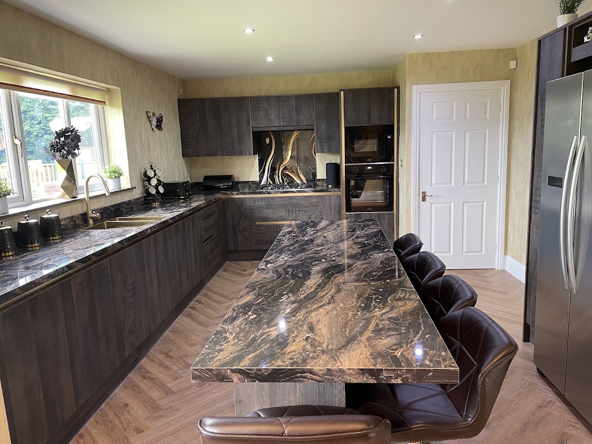 Bespoke dark timber kitchen with dramatic marble island fitted by Glen McNaughton